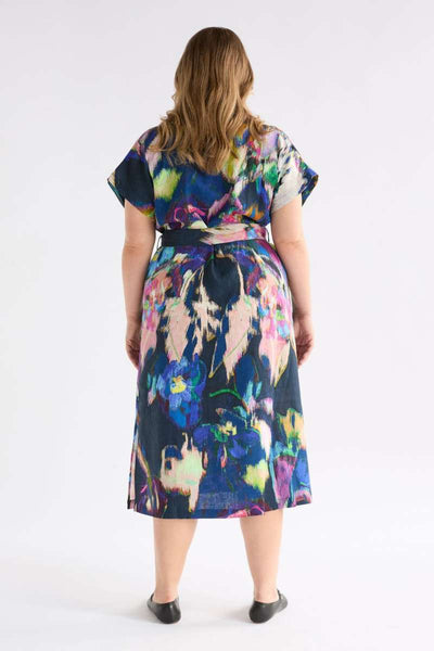 Woman wearing a colourful dress with a white background - the Lato dress by Elk the Label, stocked at Zebra Finch Style in Newcastle, NSW
