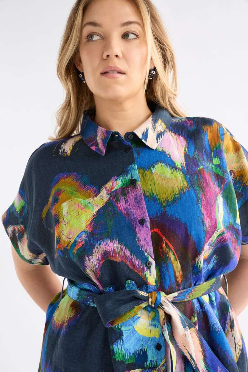 Woman wearing a colourful dress with a white background - the Lato dress by Elk the Label, stocked at Zebra Finch Style in Newcastle, NSW
