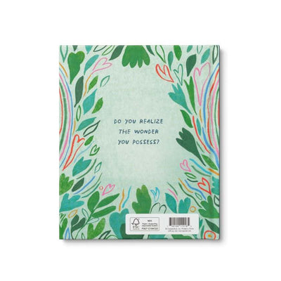 Notebook with colorful floral design and text on a white background
