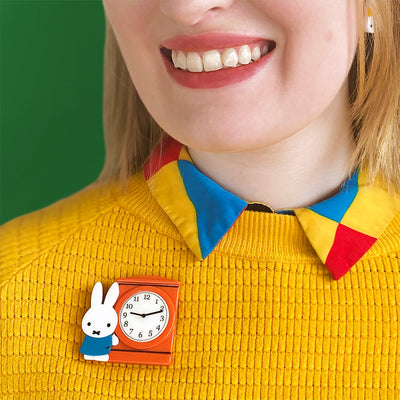 Miffy can tell the time resin brooch by Erstwilder on model's yellow shirt