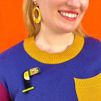 Reluctant Wingman Brooch by Erstwilder from their 2023 Terry Runyan collection on model