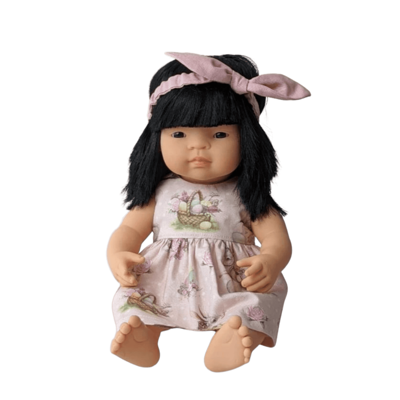 asian doll wearing pink dress and headband