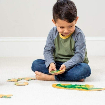 Kid completing just hatched dinosaur puzzle