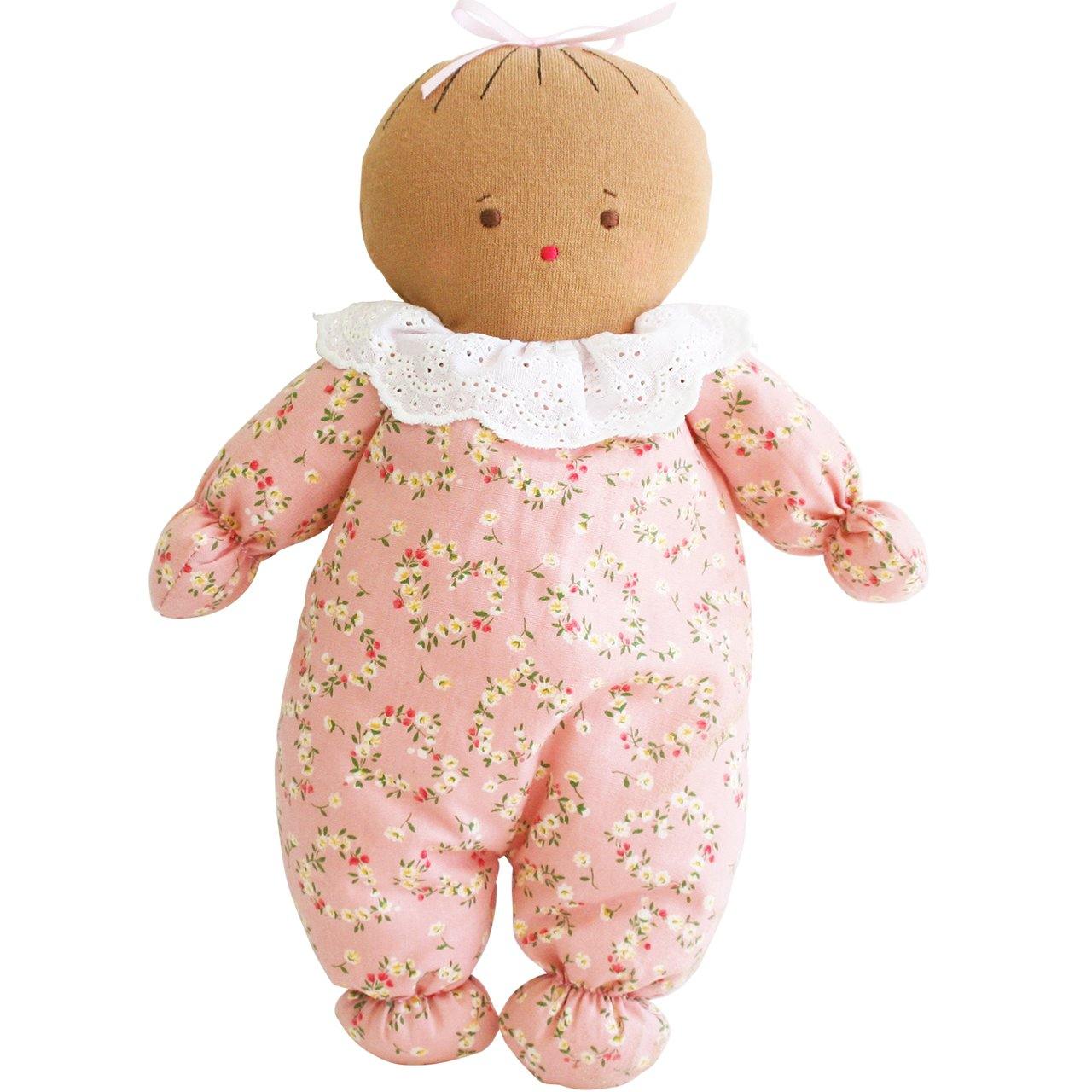 Awake alsleep doll with eyes open and pink floral design on body