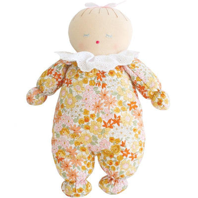 Awake sleep doll with eyes shut, with light skin and orange marigold floral design on body