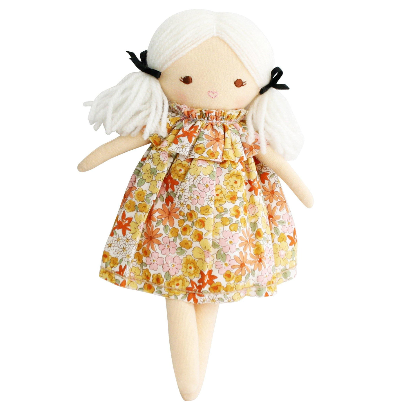 Matilda doll with floral dress and white hair with wide open eyes