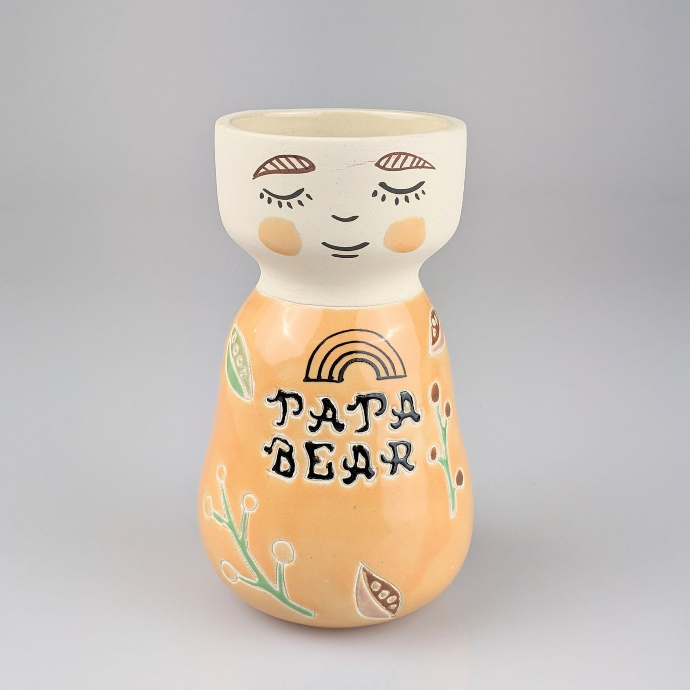 Light orange face vase with the words Papa Bear written across the front