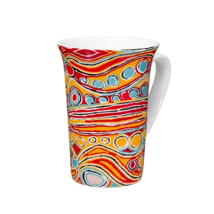 Judy Watson orange and yellow artwork on ceramic coffee mug