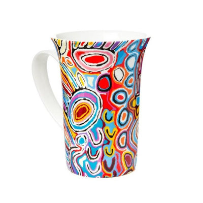 Judy watson bright blue, pink, red and orange artwork on ceramic coffee mug