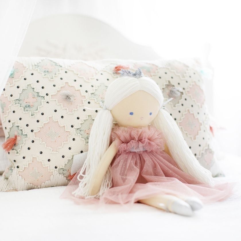 Penelope princess doll on bed