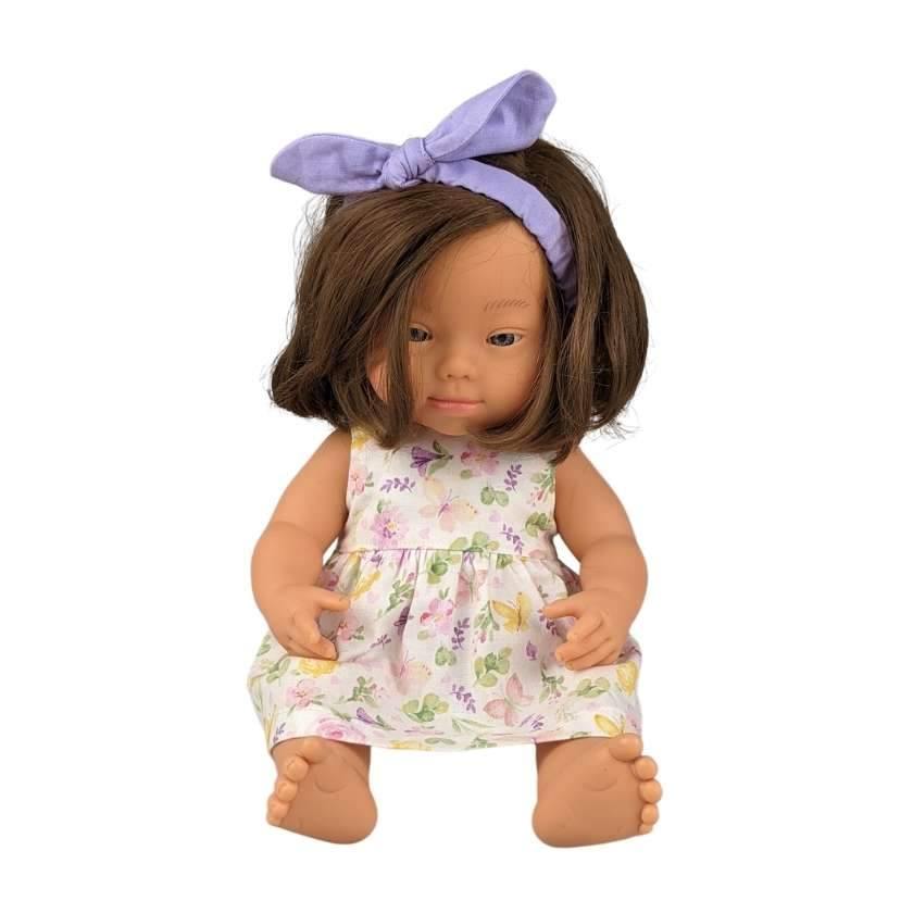 springtime dress and matching headband on girl miniland doll